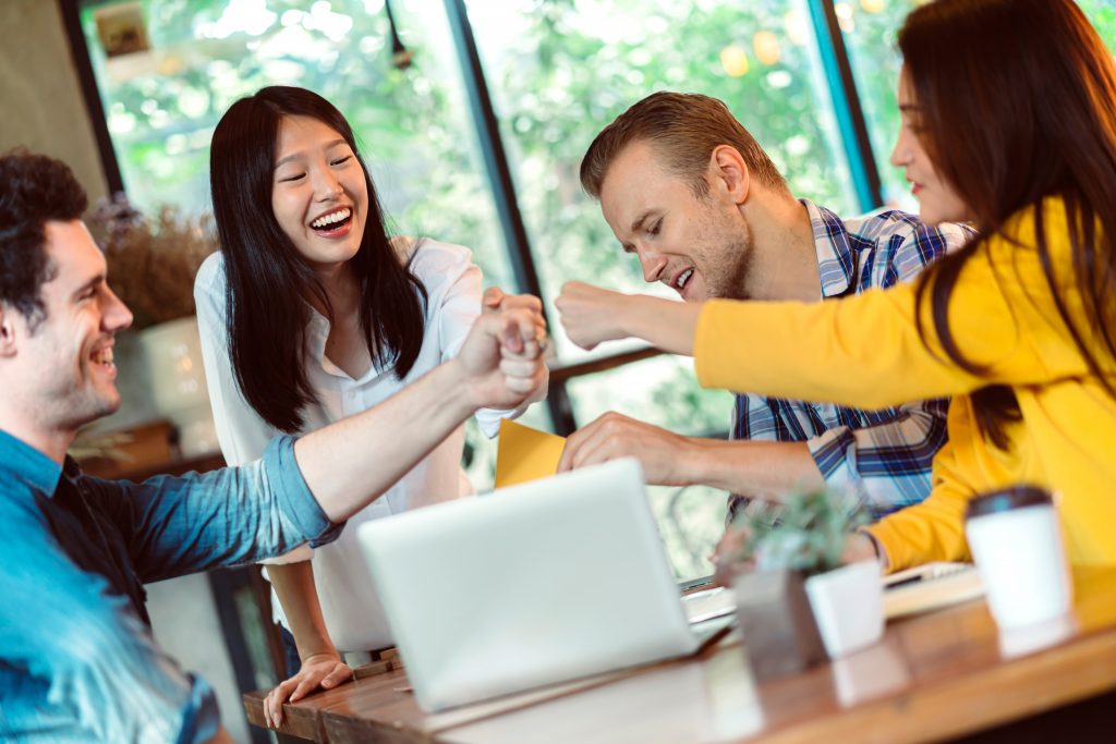 team cheers on successfully turning on computer remotely by TeamViewer Wake on Lan