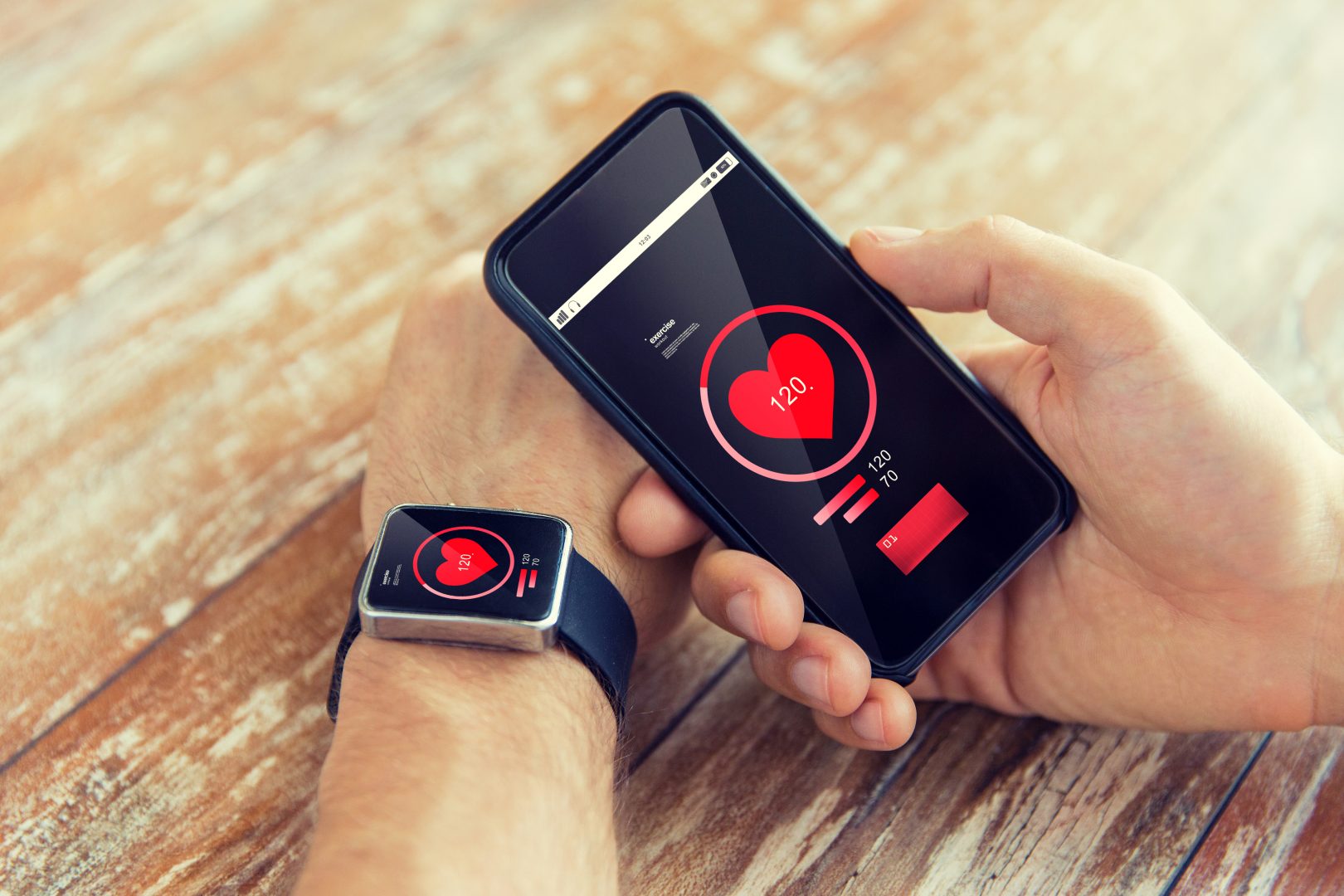 man using wearable heart tracker device, iot healthcare, on phone and watch